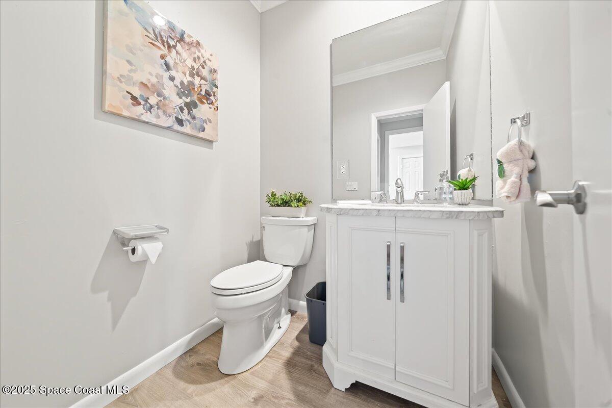 505 Sanderling Drive Indialantic, FL 32903 - Photo 32 of 63 a bathroom with a toilet sink and mirror