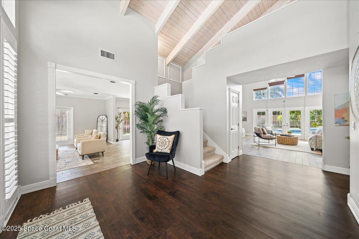 505 Sanderling Drive Indialantic, FL 32903 - Photo 4 of 63 a living room with furniture and a wooden floor
