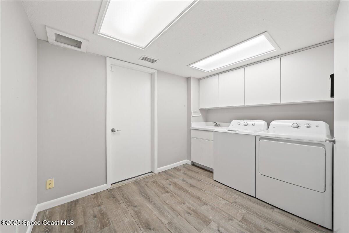 505 Sanderling Drive Indialantic, FL 32903 - Photo 46 of 63 a view of a storage & utility room with a washer dryer