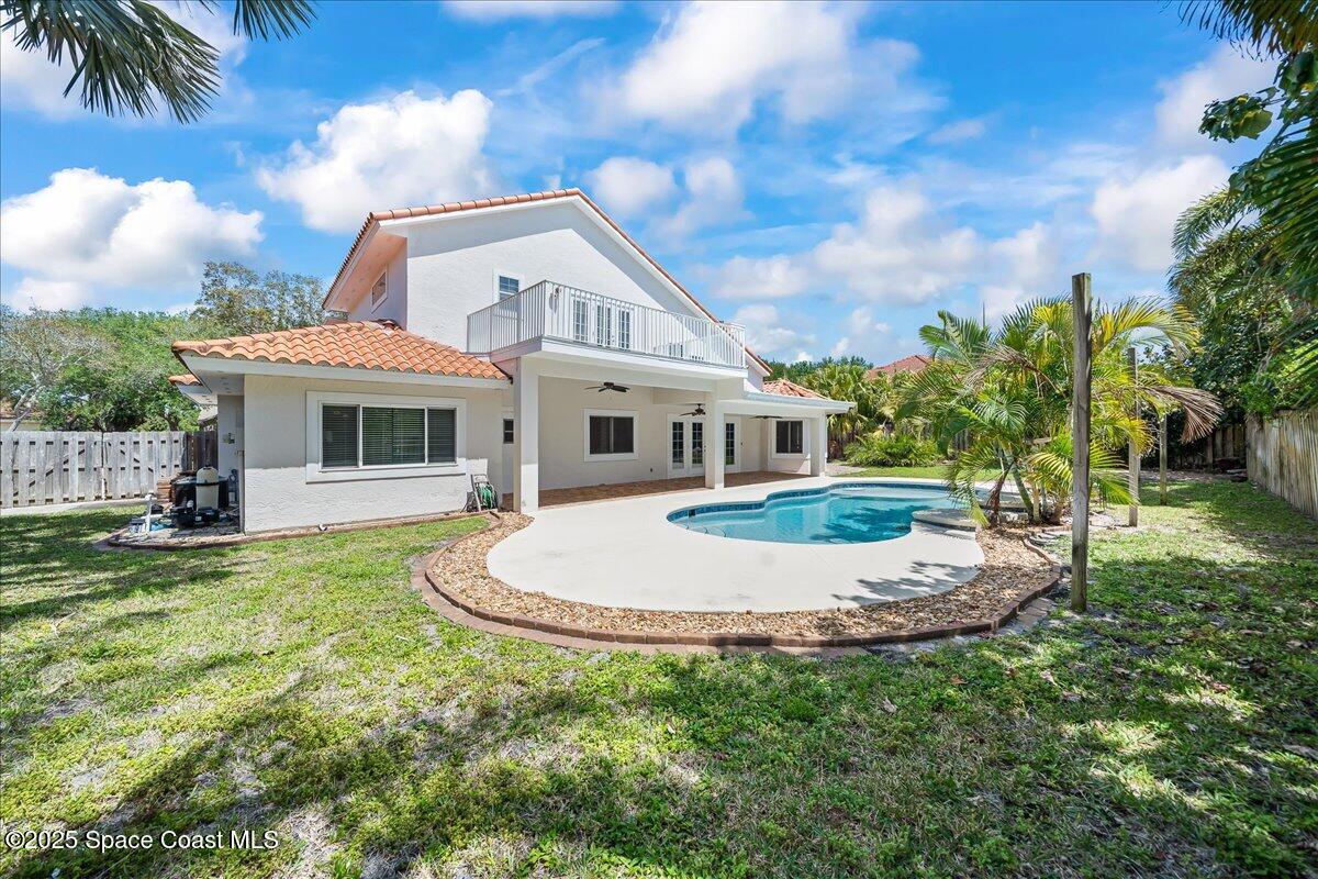 505 Sanderling Drive Indialantic, FL 32903 - Photo 48 of 63 a front view of a house with a yard table and chairs