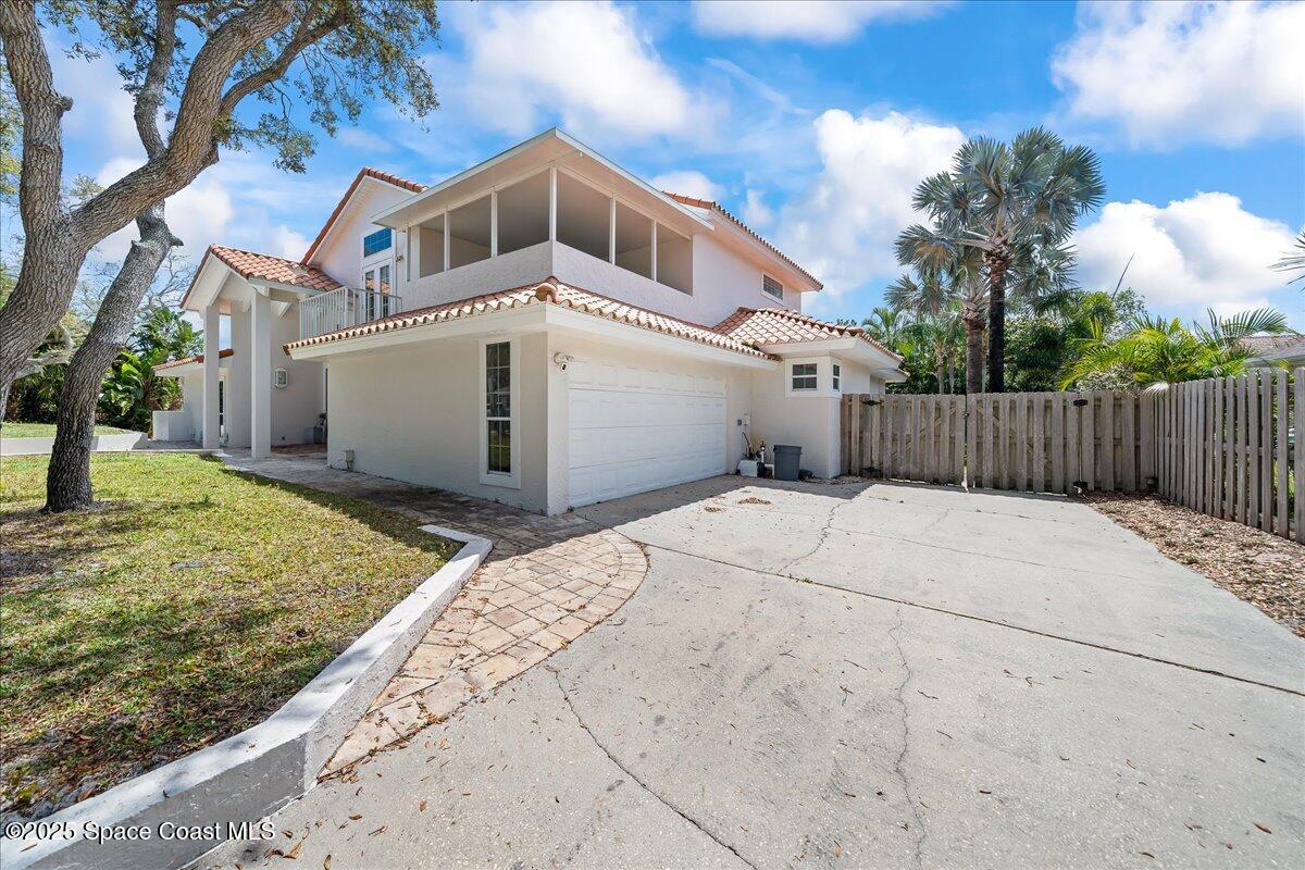 505 Sanderling Drive Indialantic, FL 32903 - Photo 53 of 63 a front view of a house with a yard