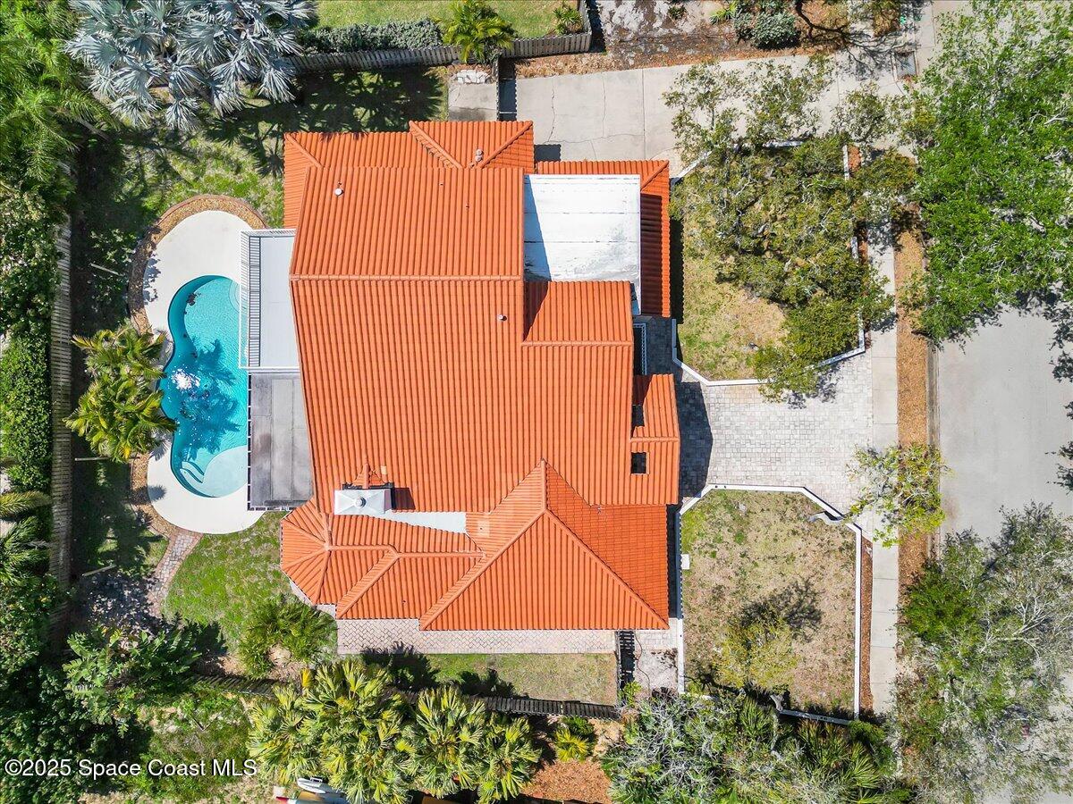 505 Sanderling Drive Indialantic, FL 32903 - Photo 56 of 63 an aerial view of a house with swimming pool and large trees