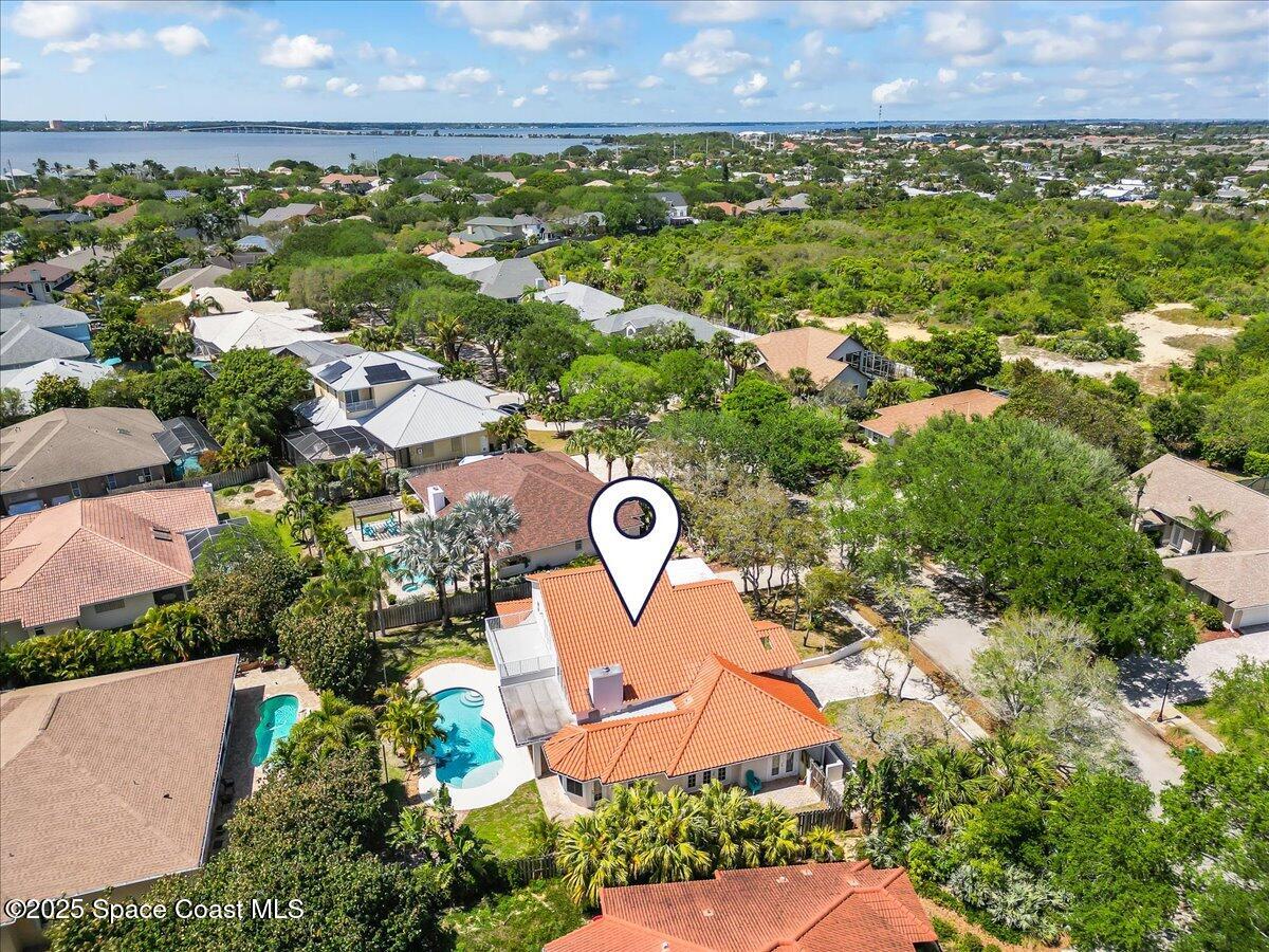 505 Sanderling Drive Indialantic, FL 32903 - Photo 62 of 63 an aerial view of a house with a garden and a yard