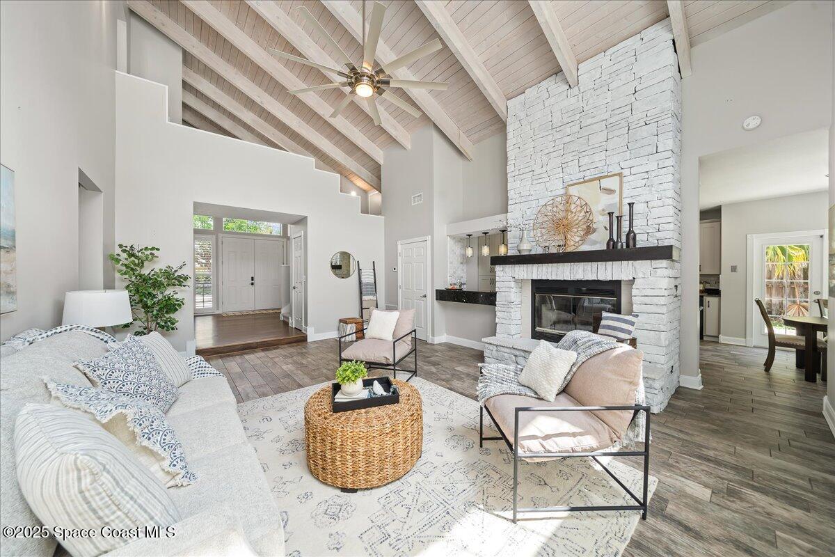 505 Sanderling Drive Indialantic, FL 32903 - Photo 9 of 63 a living room with furniture and a fireplace