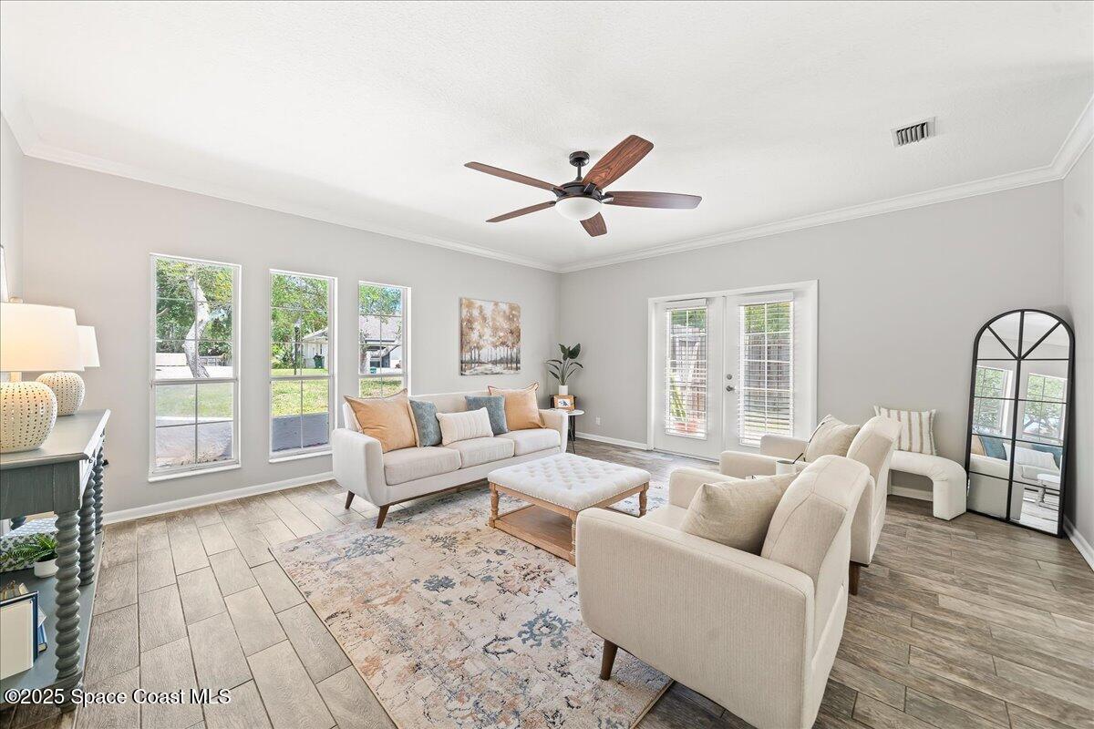 505 Sanderling Drive Indialantic, FL 32903 - Photo 10 of 63 a living room with furniture and a large window
