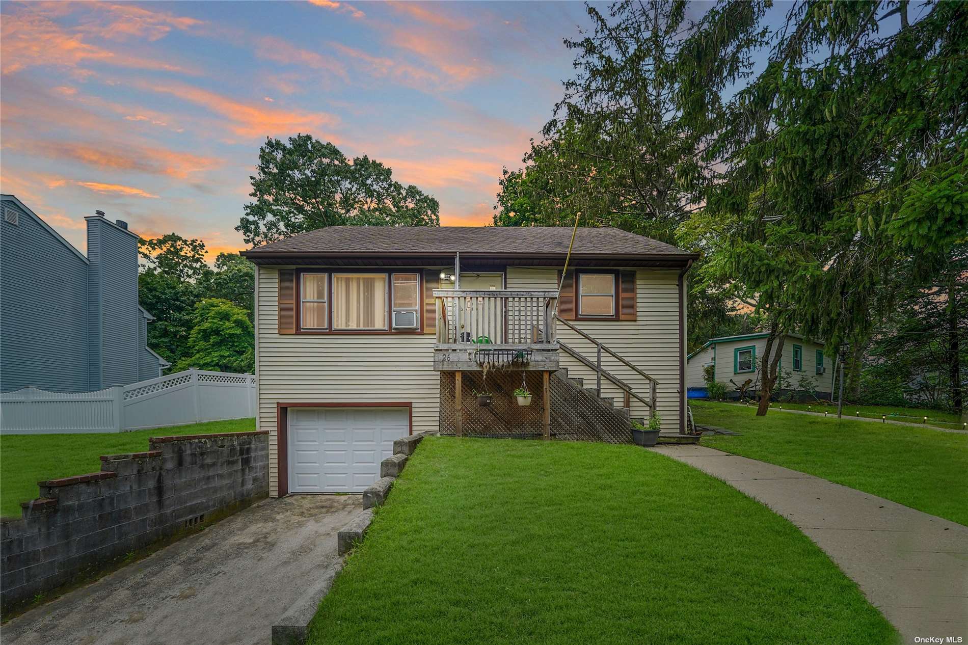 26 Inwood Road Sound Beach, NY 11789 - Photo 1 of 1 a front view of house with yard and green space