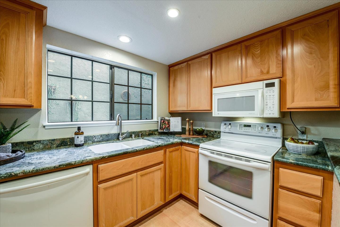 3120 Heather Ridge Drive San Jose, CA 95136 - Photo 13 of 25 a kitchen with granite countertop cabinets stainless steel appliances a sink and window