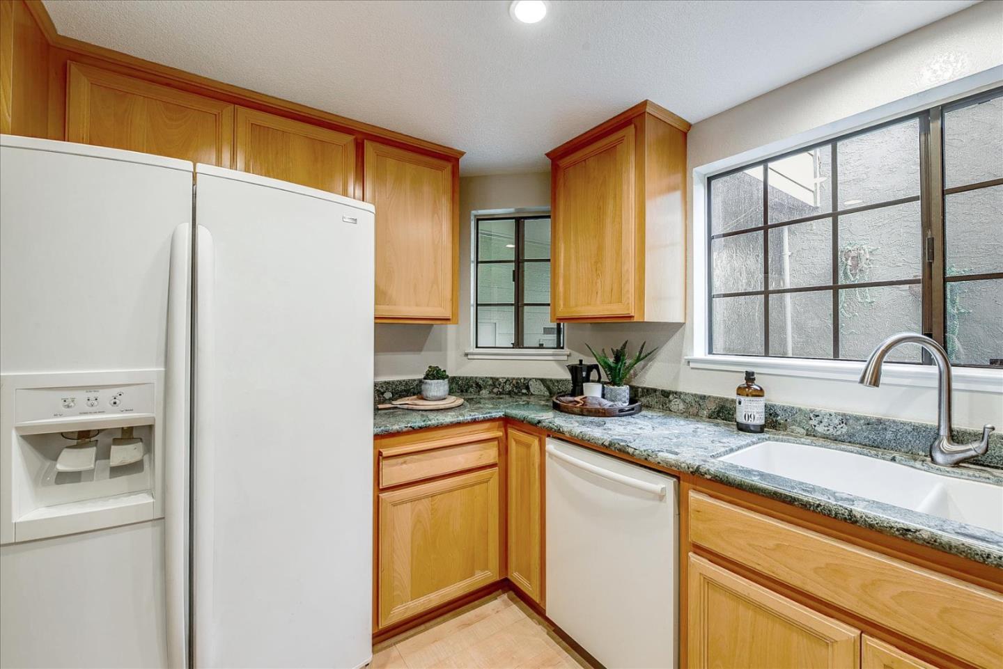 3120 Heather Ridge Drive San Jose, CA 95136 - Photo 15 of 25 a bathroom with a granite countertop sink and a mirror