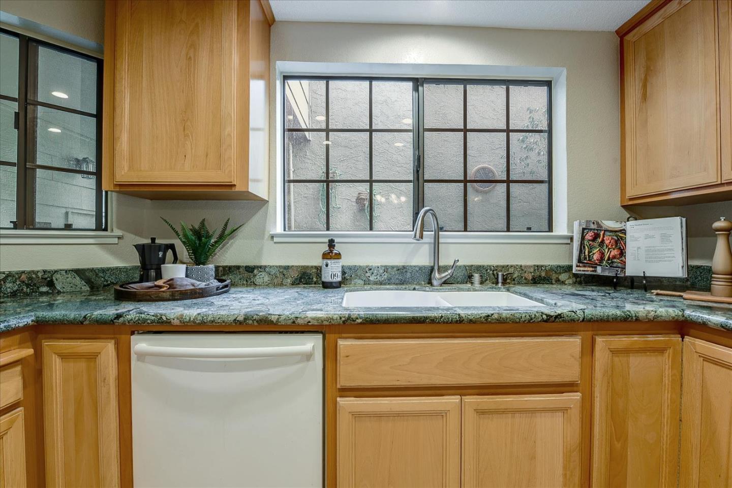 3120 Heather Ridge Drive San Jose, CA 95136 - Photo 16 of 25 a kitchen with granite countertop white cabinets and a window