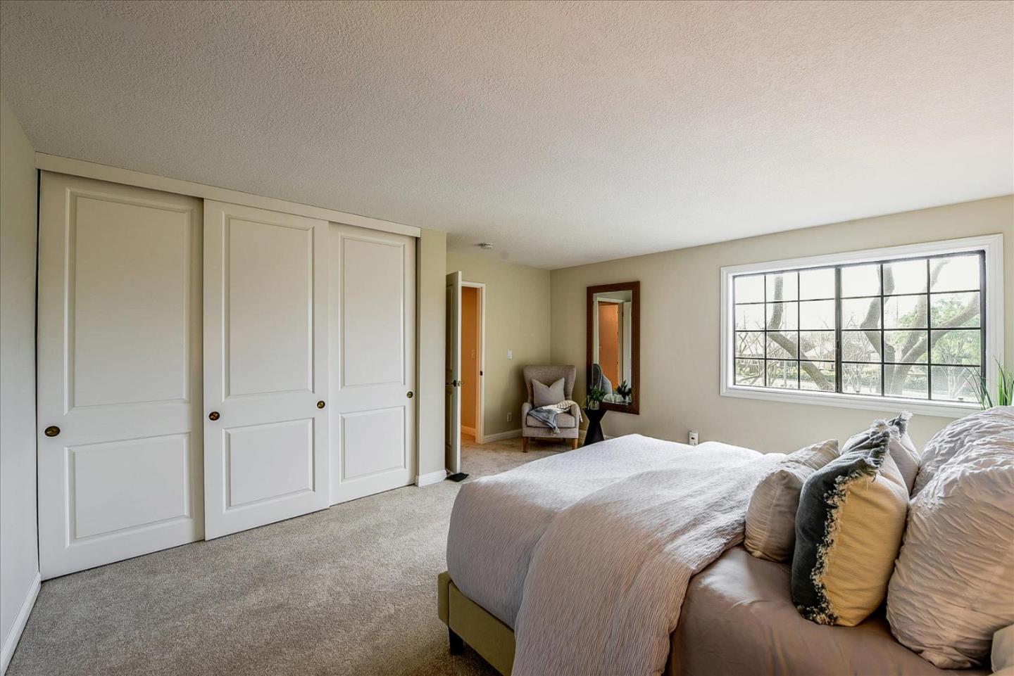 3120 Heather Ridge Drive San Jose, CA 95136 - Photo 20 of 25 a bedroom with a bed and a large window