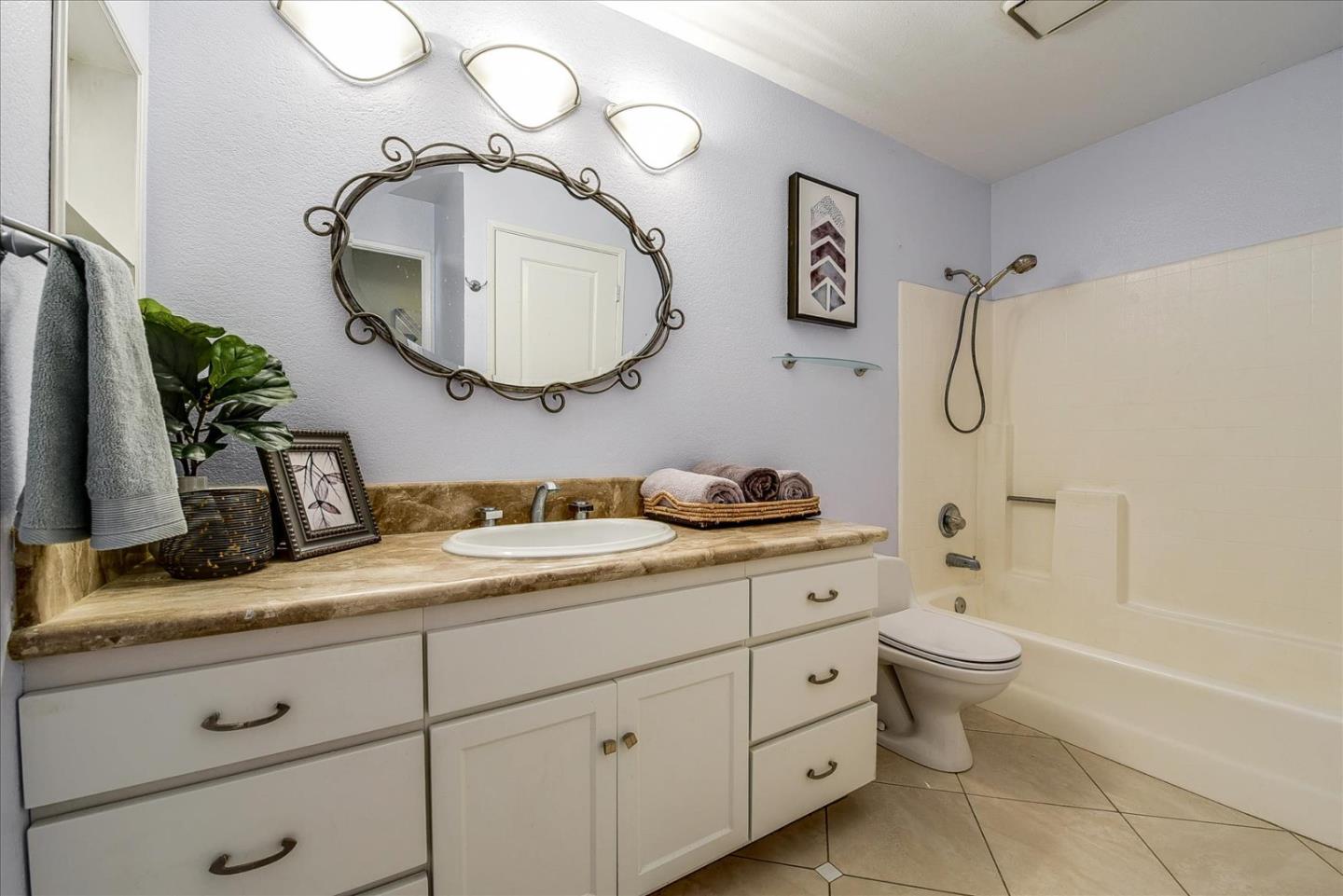 3120 Heather Ridge Drive San Jose, CA 95136 - Photo 21 of 25 a bathroom with a granite countertop sink mirror vanity and toilet