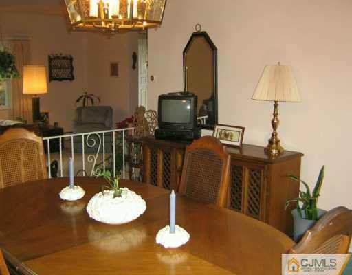 105 Dover Road Colonia, NJ 07067 - Photo 4 of 8 a view of a dining room with furniture
