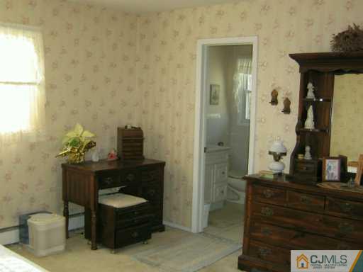 105 Dover Road Colonia, NJ 07067 - Photo 8 of 8 a bathroom with a sink and a mirror