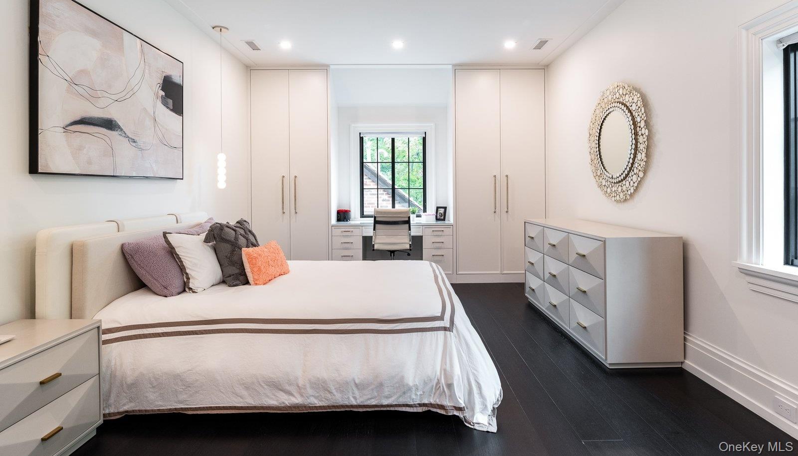 64 Cushman Road Scarsdale, NY 10583 - Photo 23 of 32 a bed room with a bed and a painting on the wall