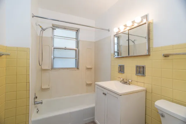 a view of a yard with a house in the background