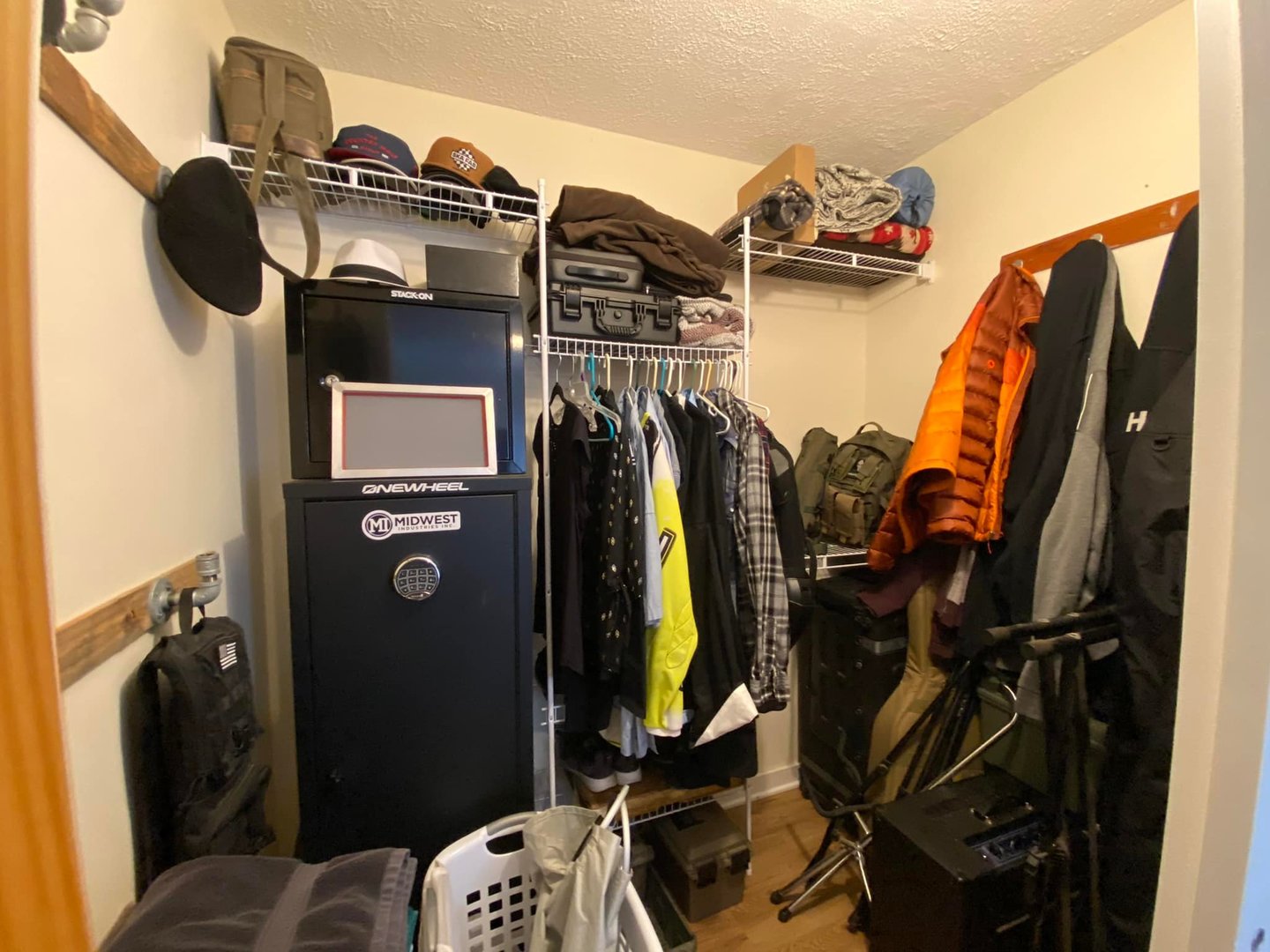 211 State Street Maple Park, IL 60151 - Photo 14 of 19 a view of walk in closet with clothes and shoes