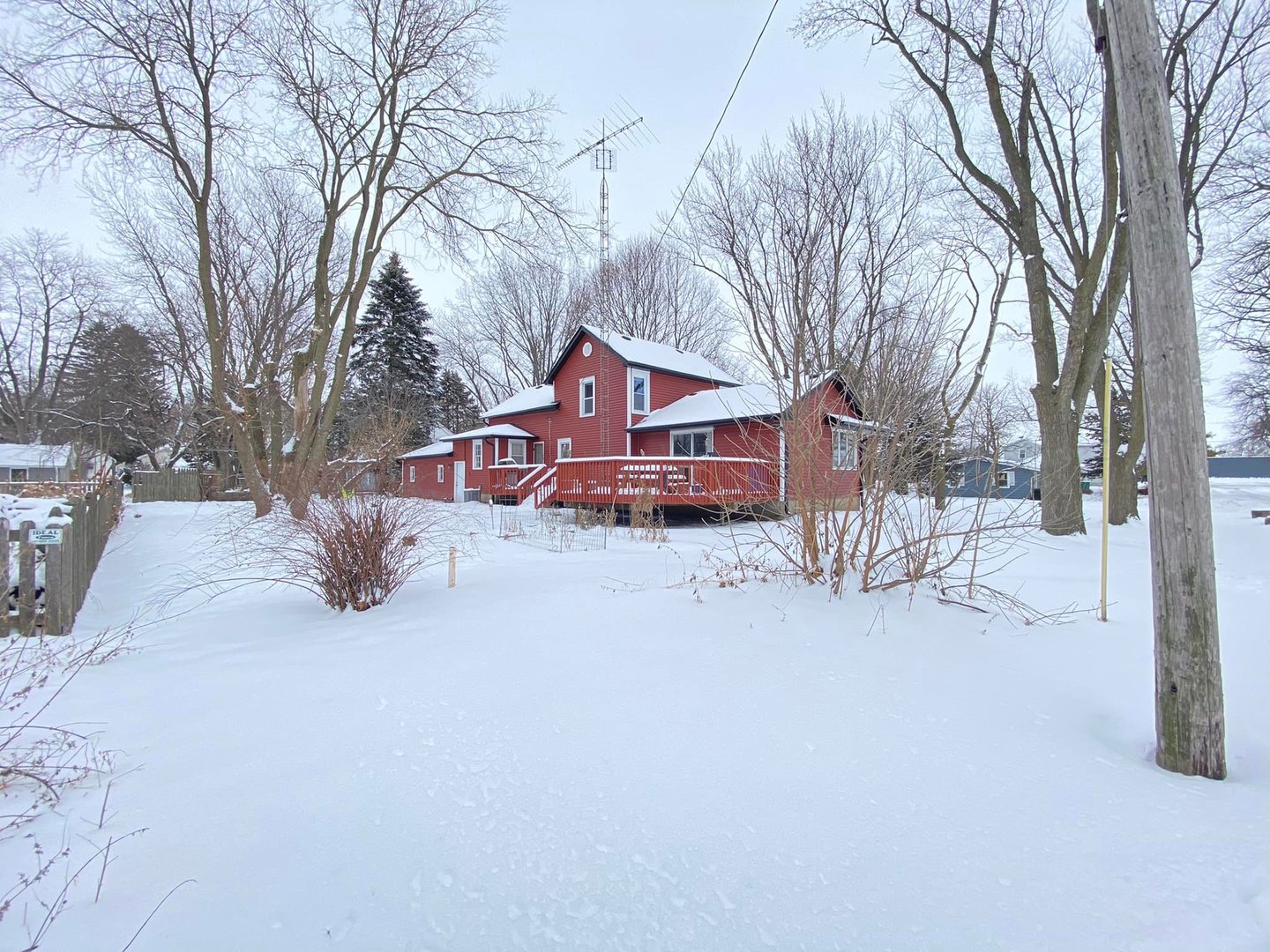 211 State Street Maple Park, IL 60151 - Photo 17 of 19 a front view of a house with a yard covered in snow