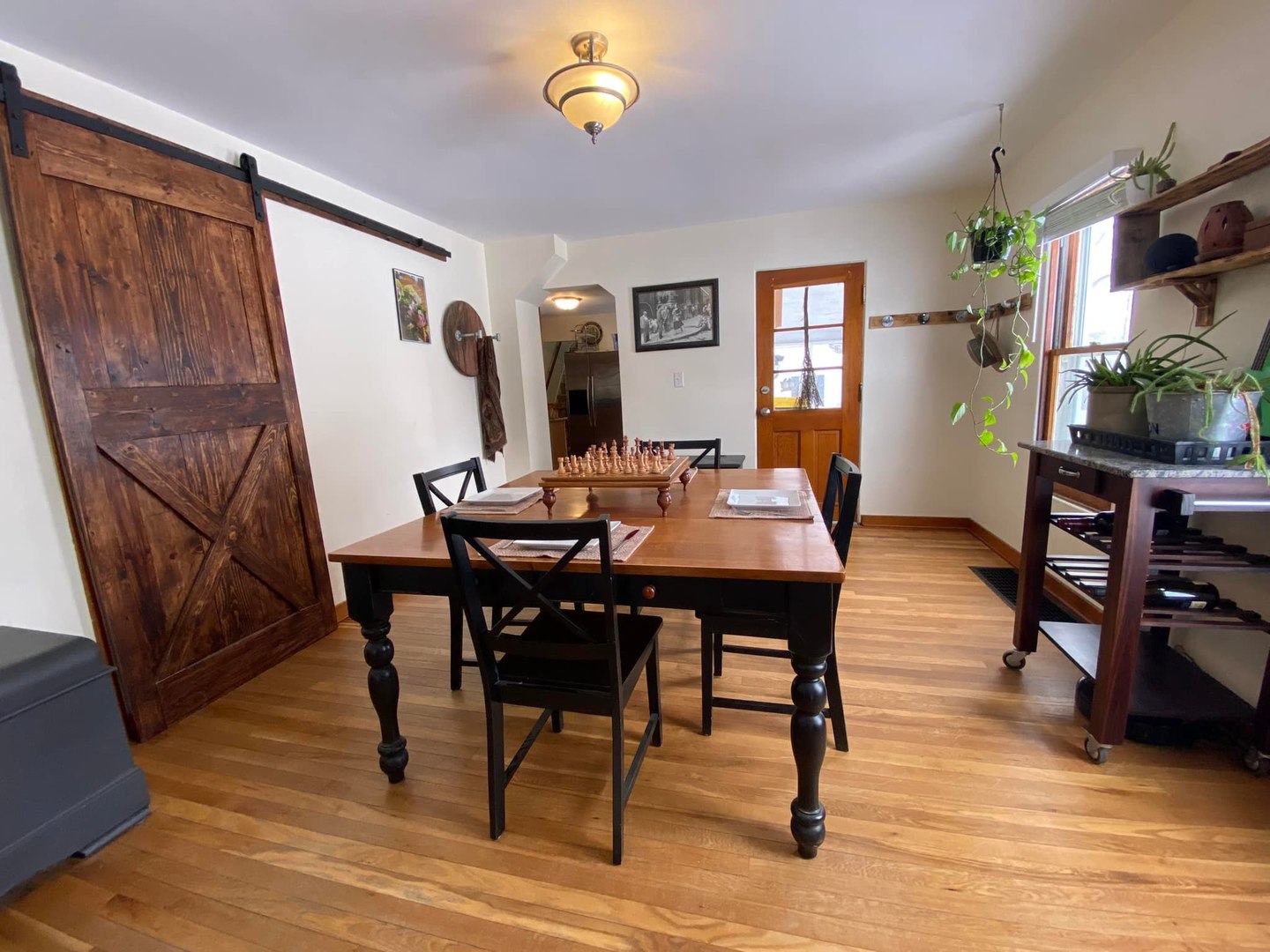 211 State Street Maple Park, IL 60151 - Photo 4 of 19 a view of a dining room with furniture and wooden floor