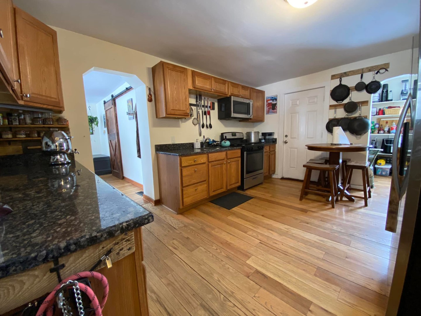 211 State Street Maple Park, IL 60151 - Photo 7 of 19 a kitchen with stainless steel appliances granite countertop a refrigerator and stove top oven