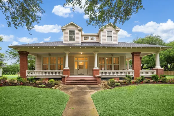 front view of a house with a yard