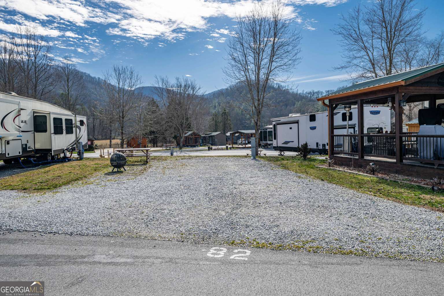 a view of a house with a yard and sitting area