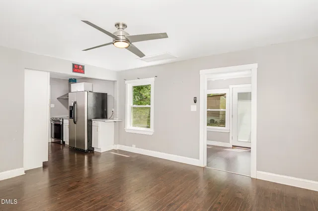 a kitchen with a refrigerator and a stove