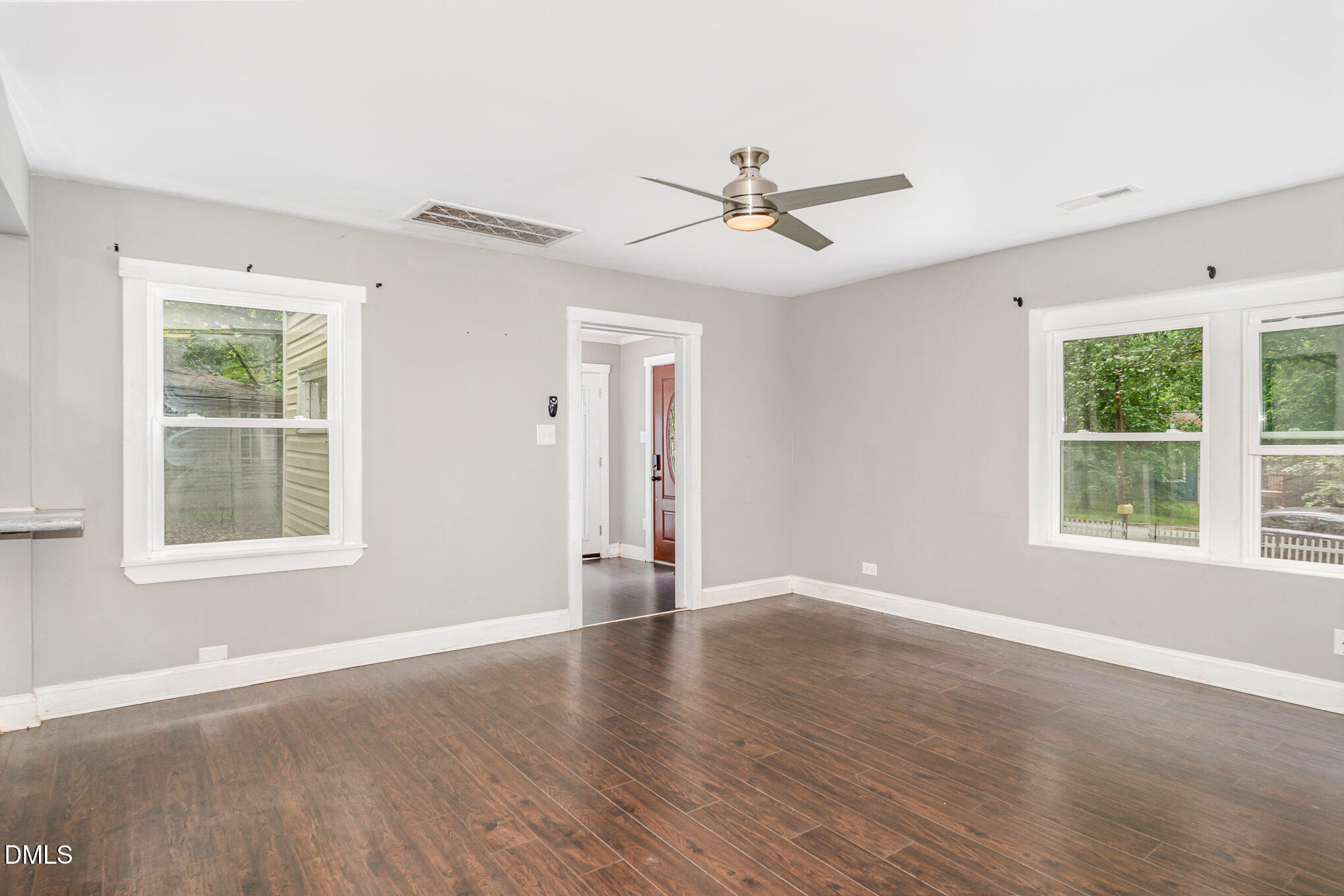1401 Robinhood Road Durham, NC 27701 - Photo 12 of 38 a view of an empty room with wooden floor and a window