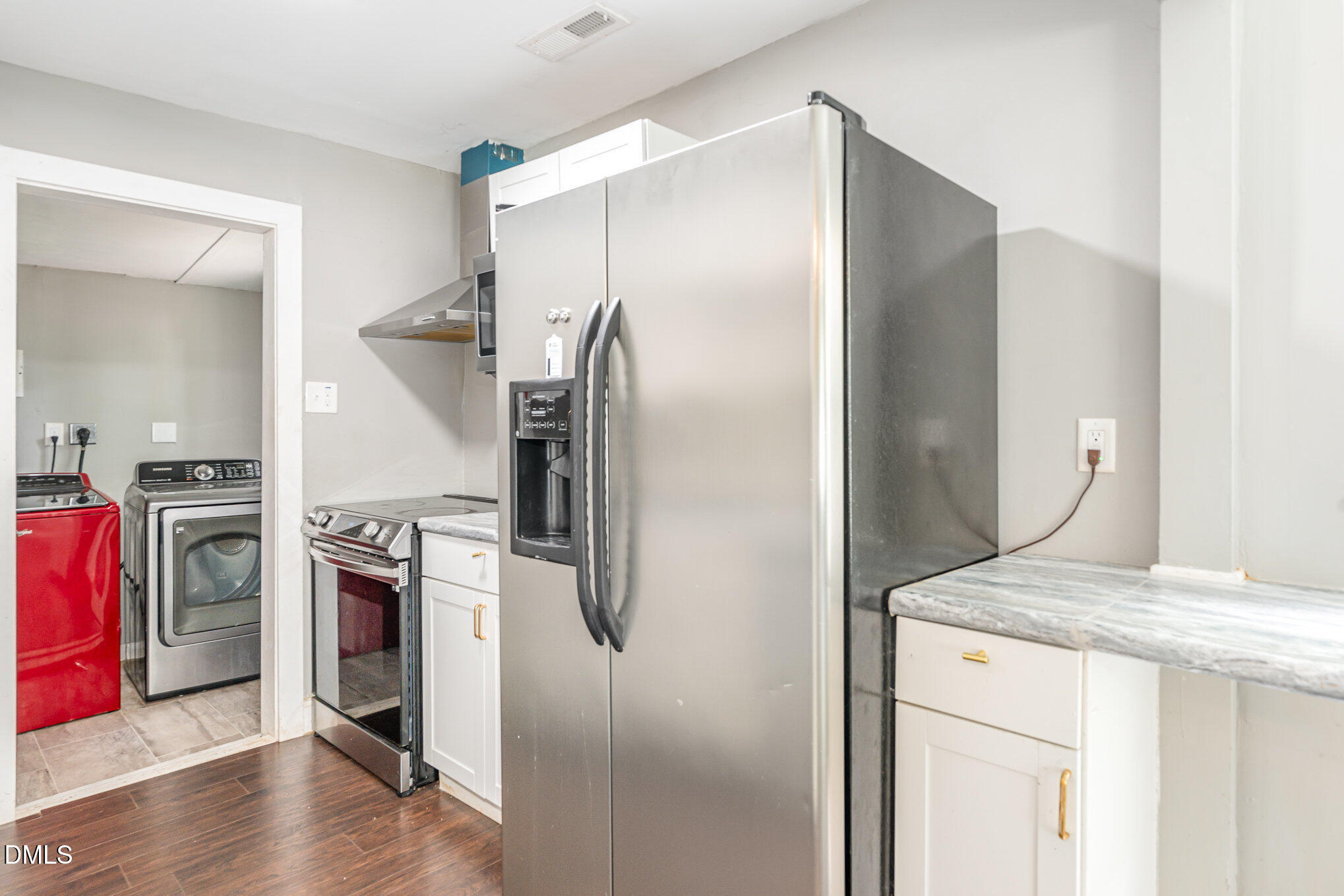 1401 Robinhood Road Durham, NC 27701 - Photo 13 of 38 a kitchen with a refrigerator and a stove