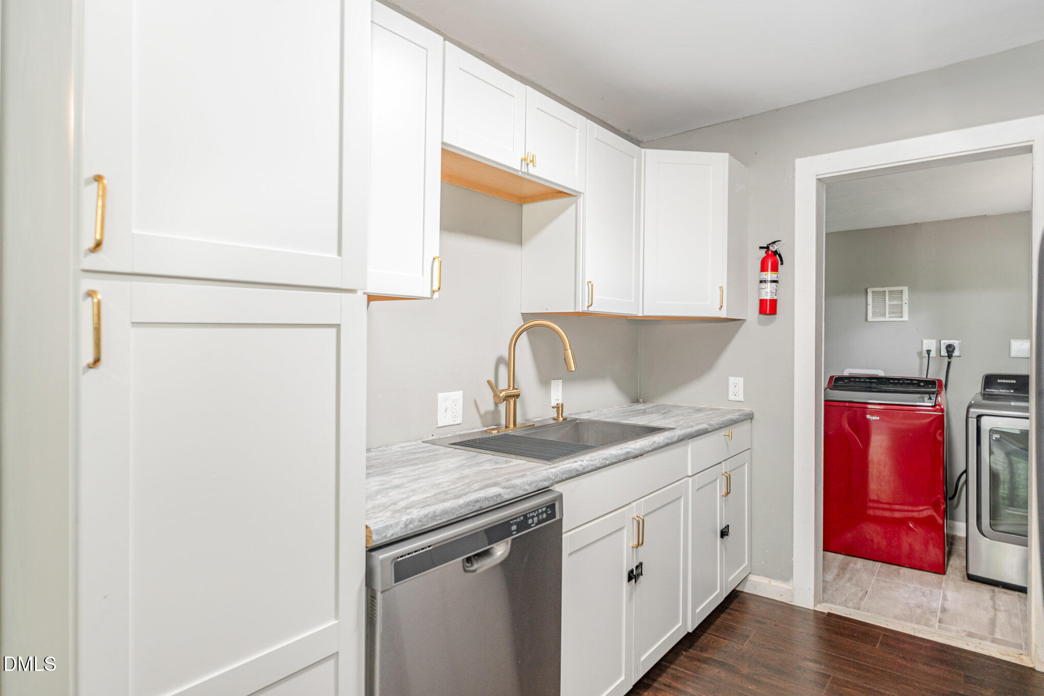 1401 Robinhood Road Durham, NC 27701 - Photo 14 of 38 a spacious bathroom with a granite countertop sink and a mirror