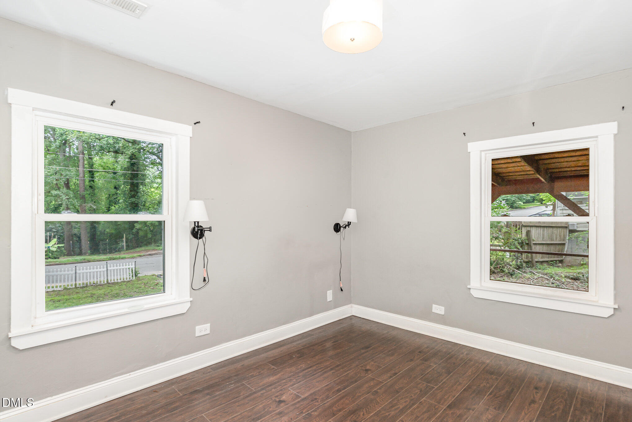 1401 Robinhood Road Durham, NC 27701 - Photo 23 of 38 an empty room with wooden floor and windows