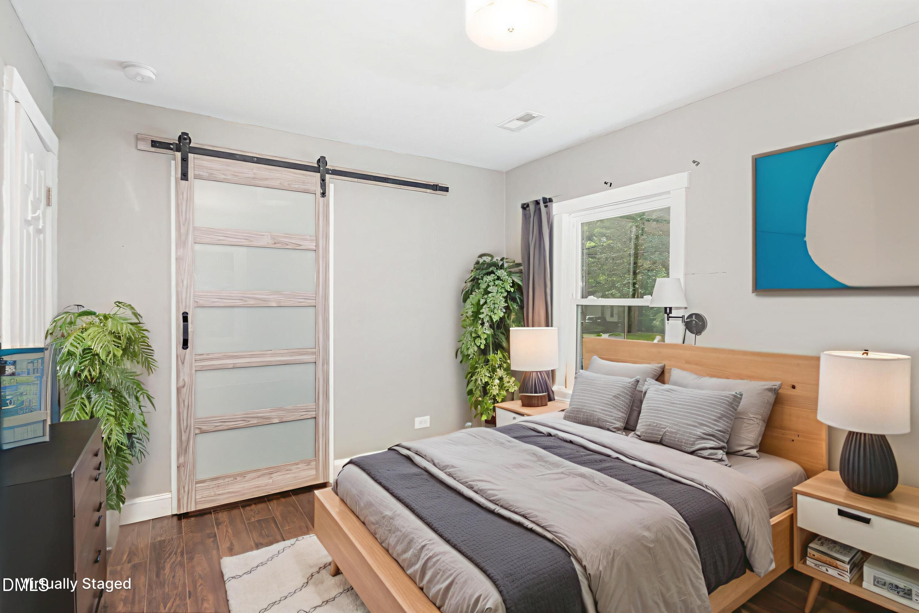 1401 Robinhood Road Durham, NC 27701 - Photo 25 of 38 a bedroom with a bed and a potted plant