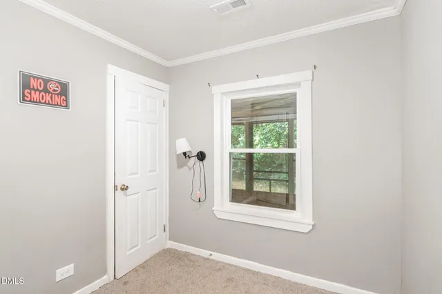 a view of front door and yard