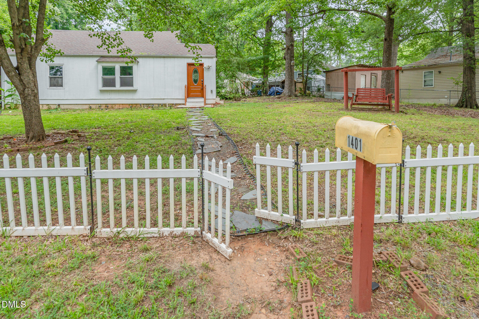 1401 Robinhood Road Durham, NC 27701 - Photo 3 of 38 a front view of a house with a yard