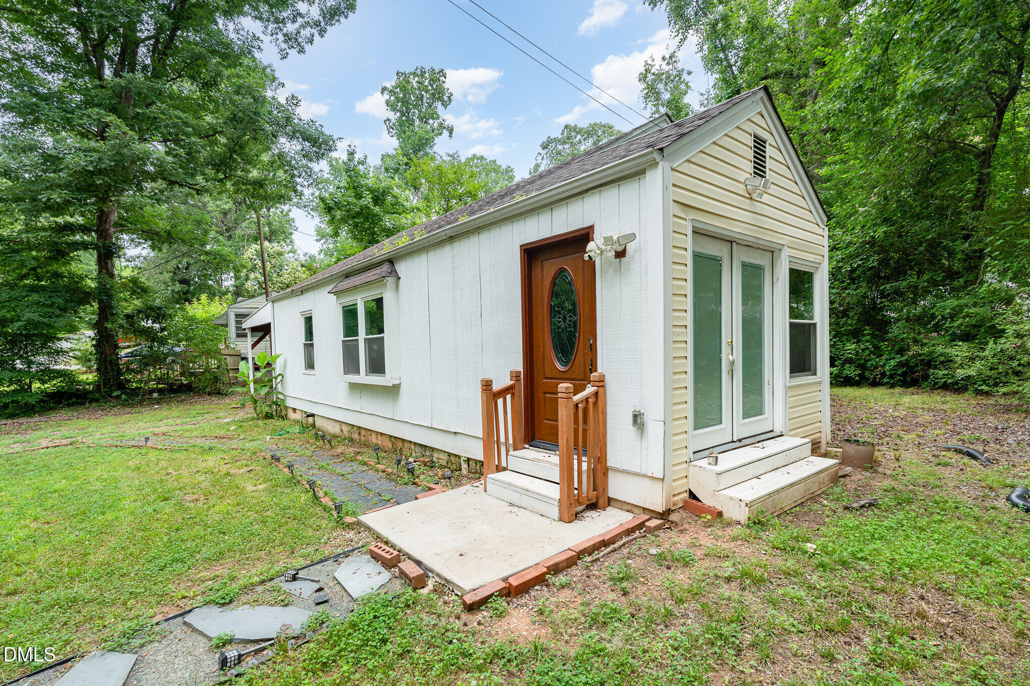1401 Robinhood Road Durham, NC 27701 - Photo 5 of 38 a front view of a house with garden