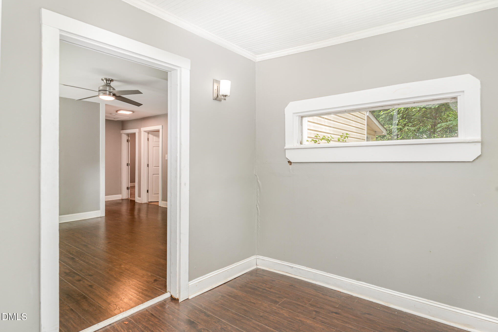 1401 Robinhood Road Durham, NC 27701 - Photo 7 of 38 a view of an empty room with wooden floor and a window