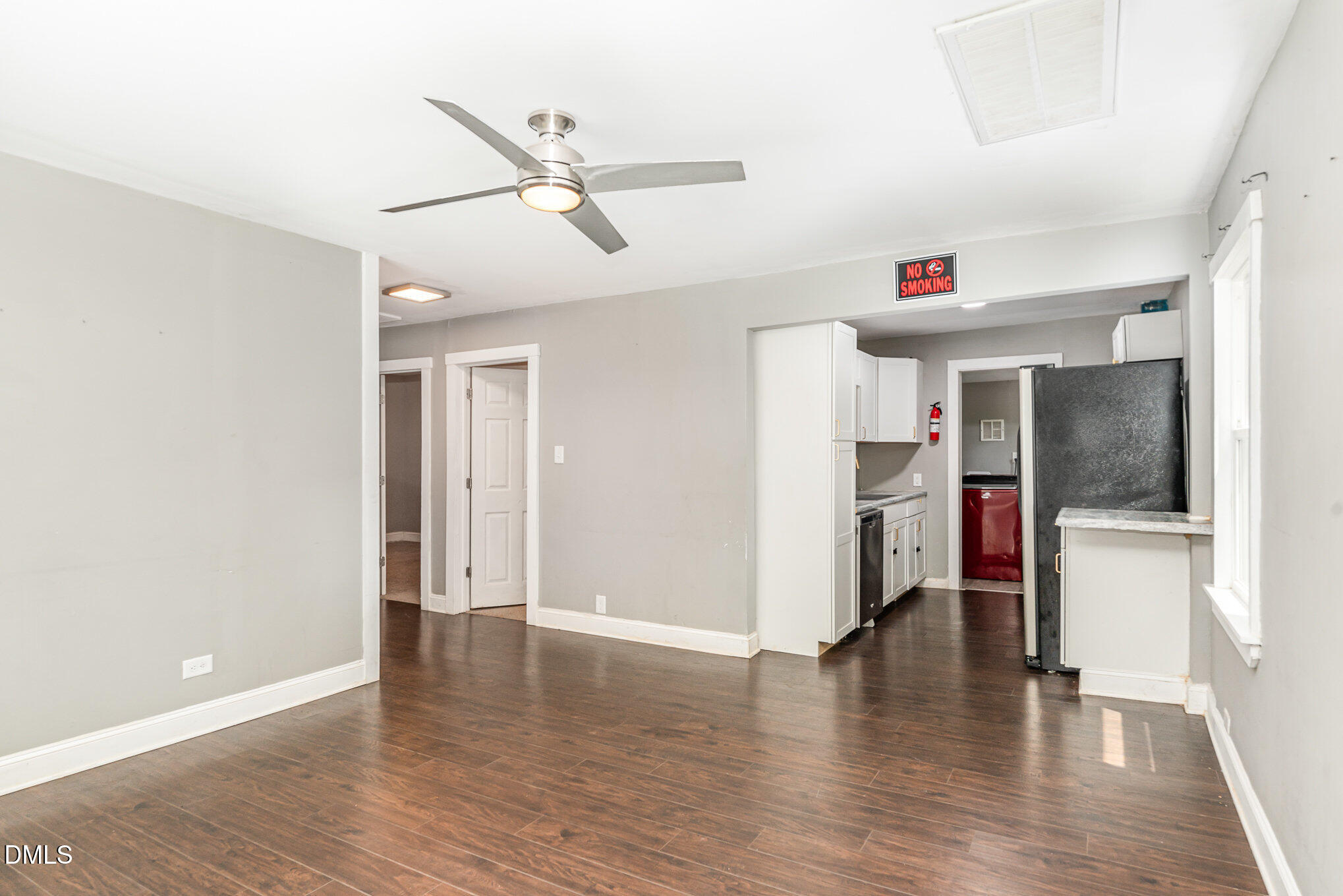 1401 Robinhood Road Durham, NC 27701 - Photo 8 of 38 a view of a room with wooden floor and a ceiling fan