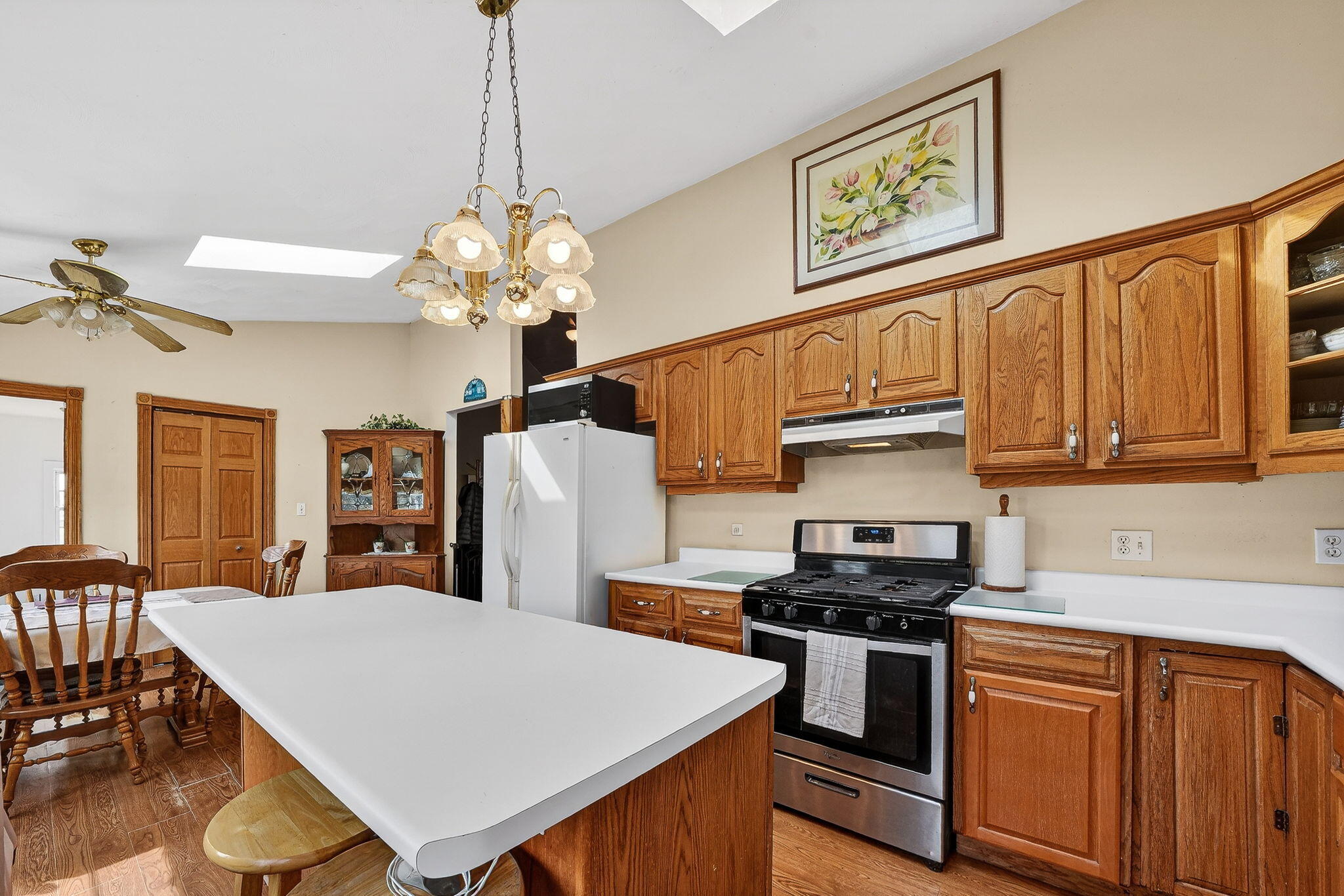11403 Highway 10 Argos, IN 46501 - Photo 6 of 50 a kitchen with stainless steel appliances granite countertop a stove a sink dishwasher and a refrigerator with wooden cabinets