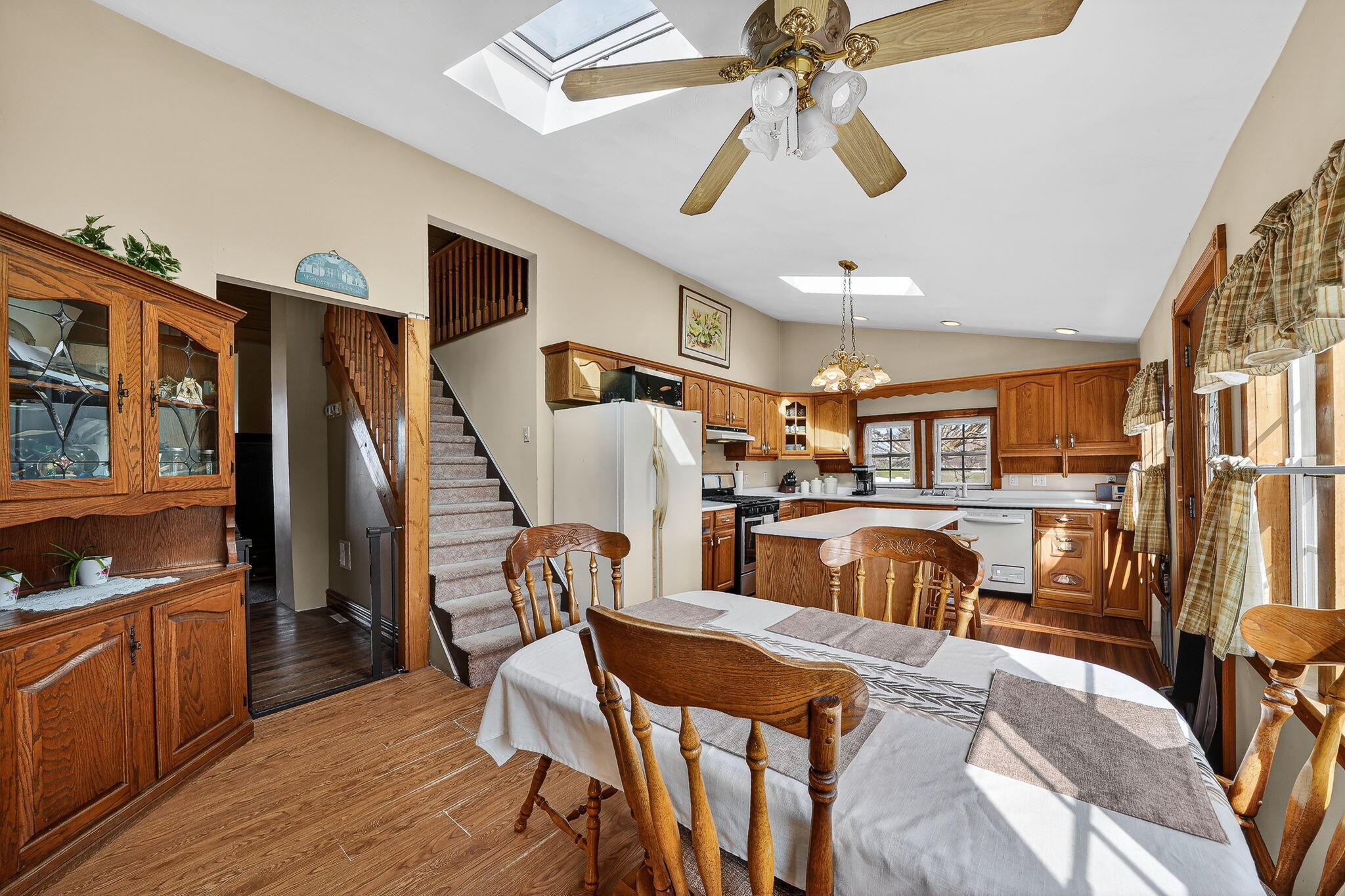 11403 Highway 10 Argos, IN 46501 - Photo 7 of 50 a view of a livingroom with furniture a ceiling fan and staircase