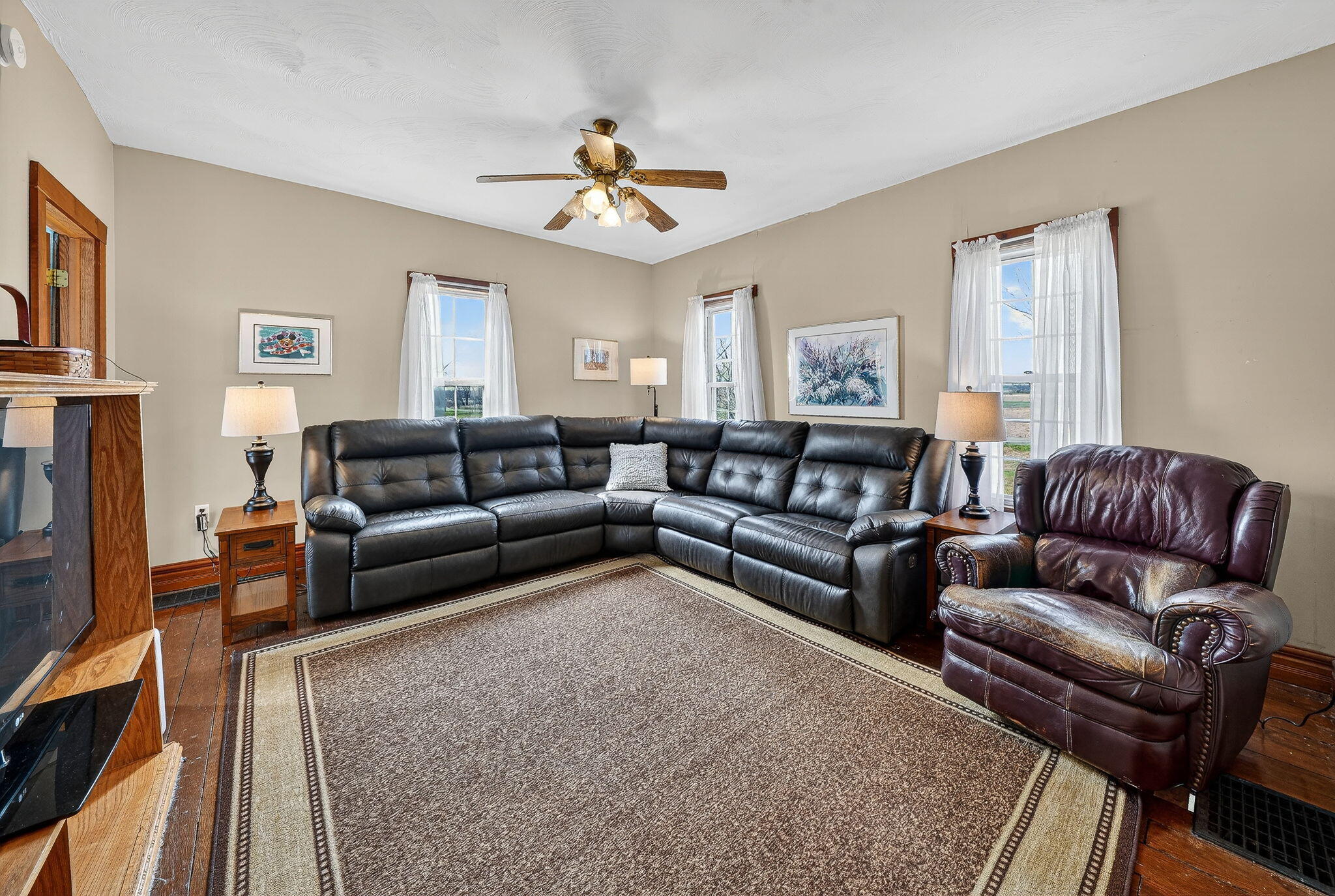 11403 Highway 10 Argos, IN 46501 - Photo 9 of 50 a living room with furniture ceiling fan and a rug