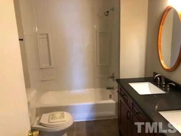 a bathroom with a sink a toilet and a bathtub