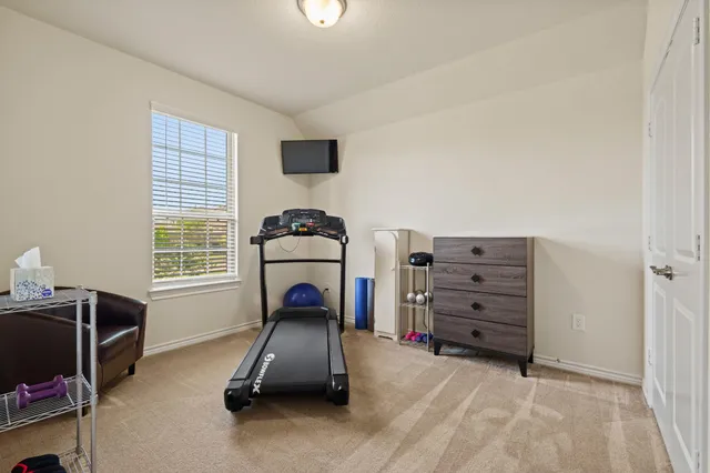 a room with furniture and a flat screen tv
