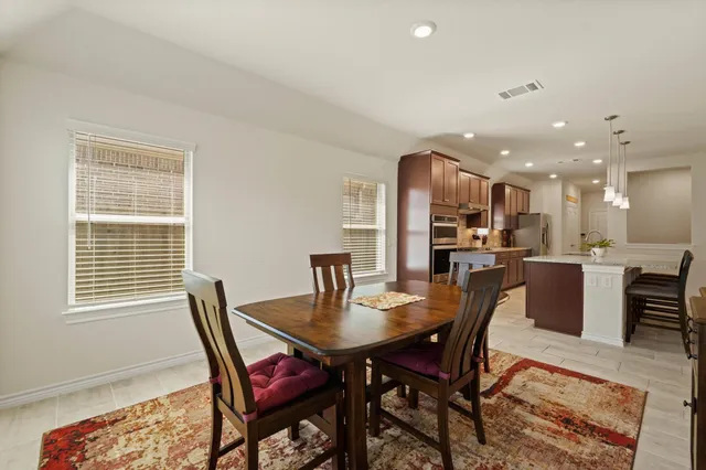 a view of a dining room with furniture