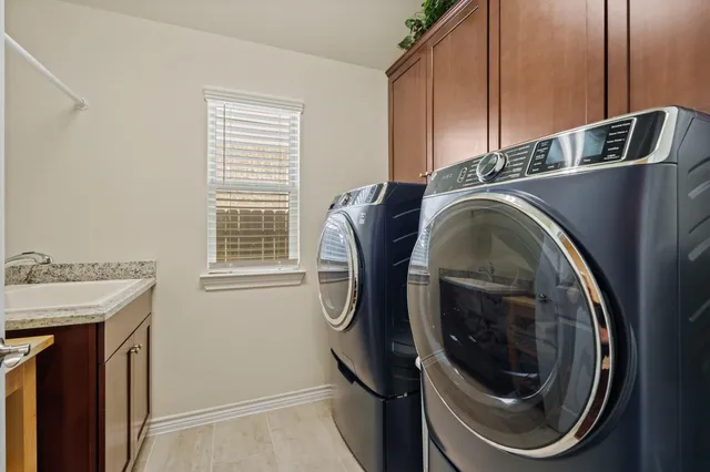 a utility room with dryer and washer