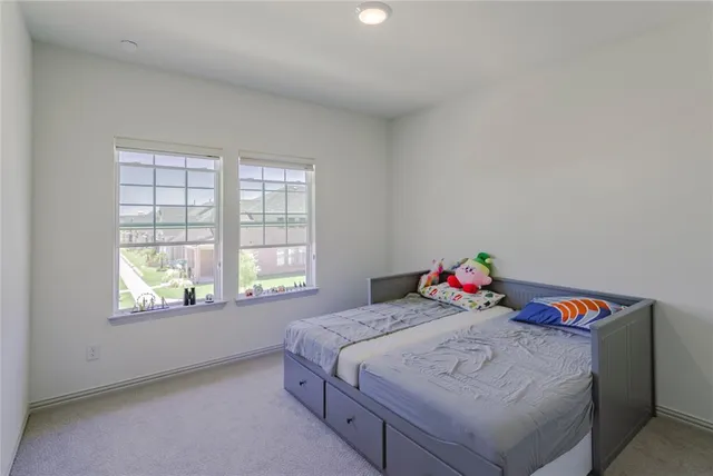 a bathroom with a double vanity sink toilet and a mirror