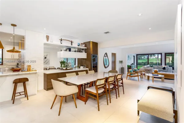 a bathroom with a sink toilet a mirror and shower
