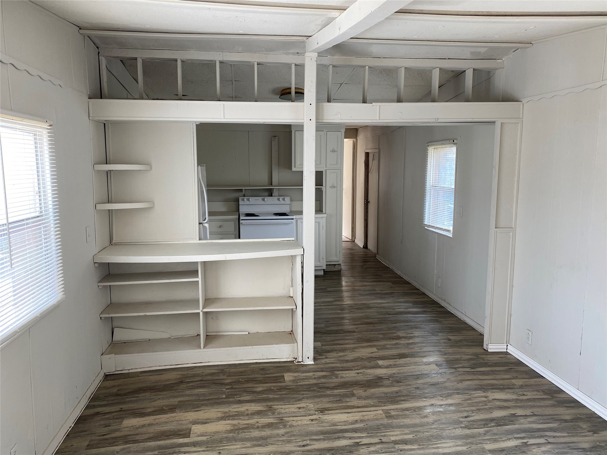 310 Harris Road, Unit B Highlands, TX 77562 - Photo 5 of 14 a view of room with window and wooden floor
