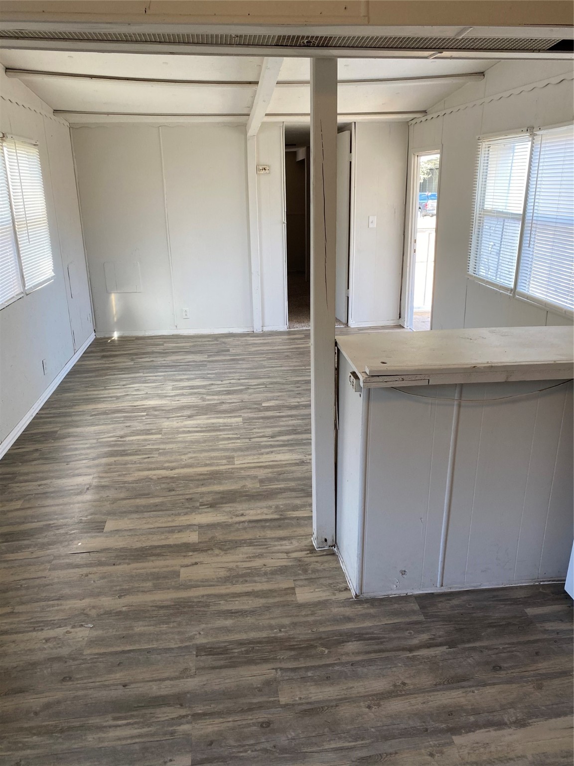 310 Harris Road, Unit B Highlands, TX 77562 - Photo 9 of 14 a view of wooden floor and cabinets in a room