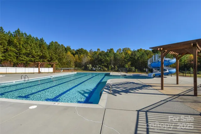 a view of a yard and front view of a house