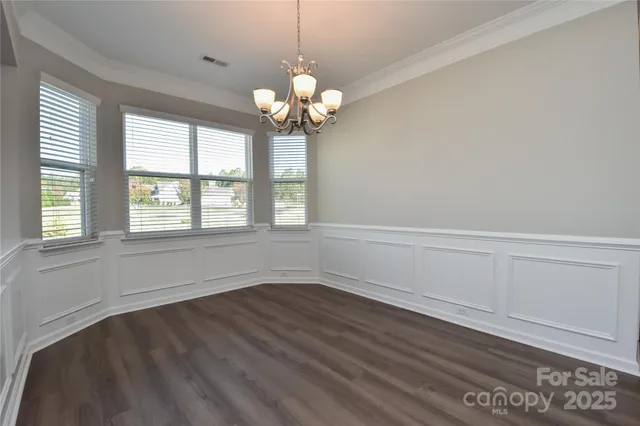 a view of room with window and ceiling fan