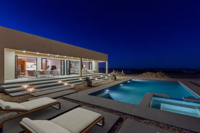 a view of a patio with swimming pool table and chairs